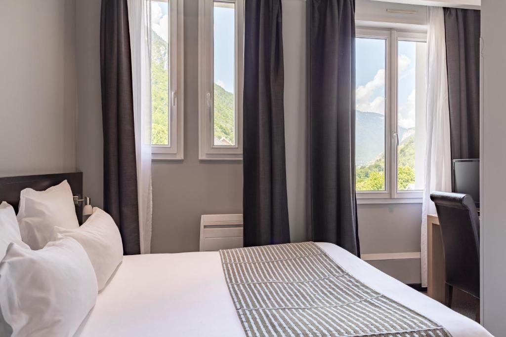 Postel nebo postele na pokoji v ubytování Golf Hôtel