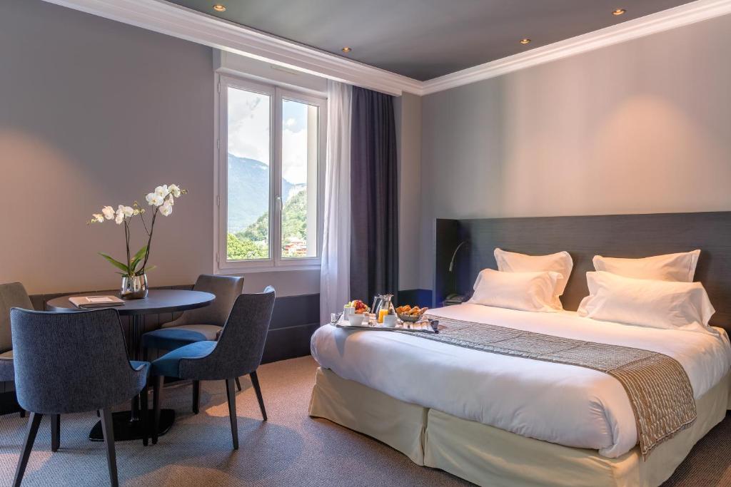 Postel nebo postele na pokoji v ubytování Golf Hôtel