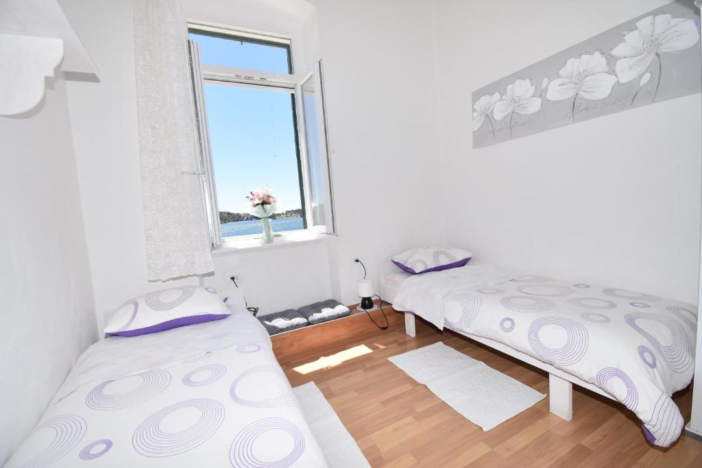 Кровать или кровати в номере Apartmani Rina