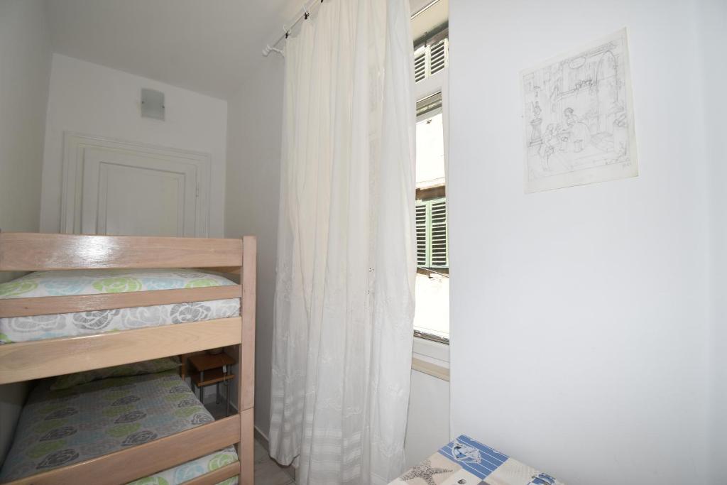 Кровать или кровати в номере Apartmani Rina