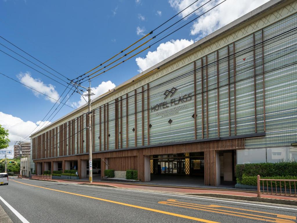 a building on the side of a street at Hotel Flags Isahaya Nagasaki in Isahaya