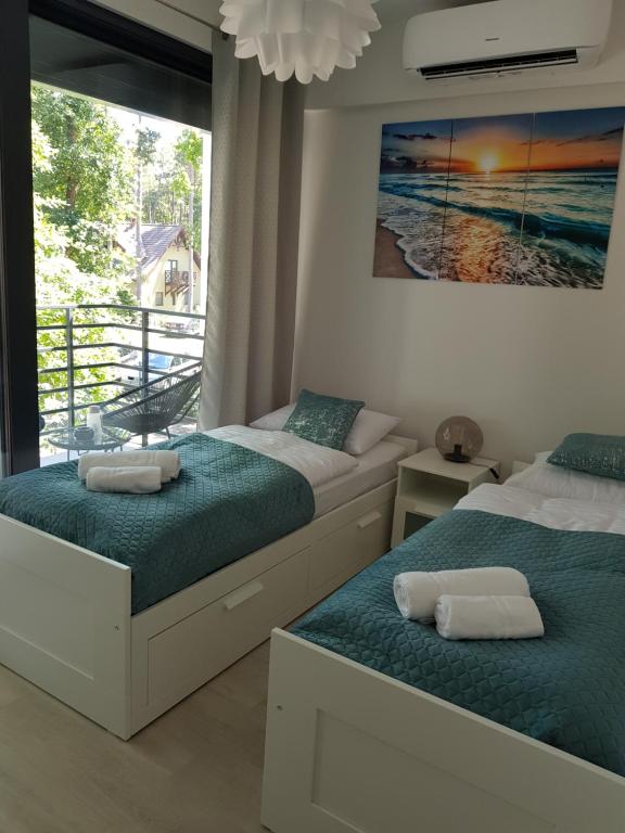 Posteľ alebo postele v izbe v ubytovaní Aprum Apartments 12C