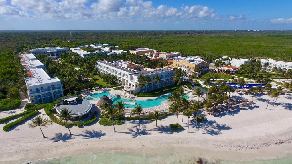 an aerial view of a resort on the beach at Dreams Tulum Resort & Spa in Tulum