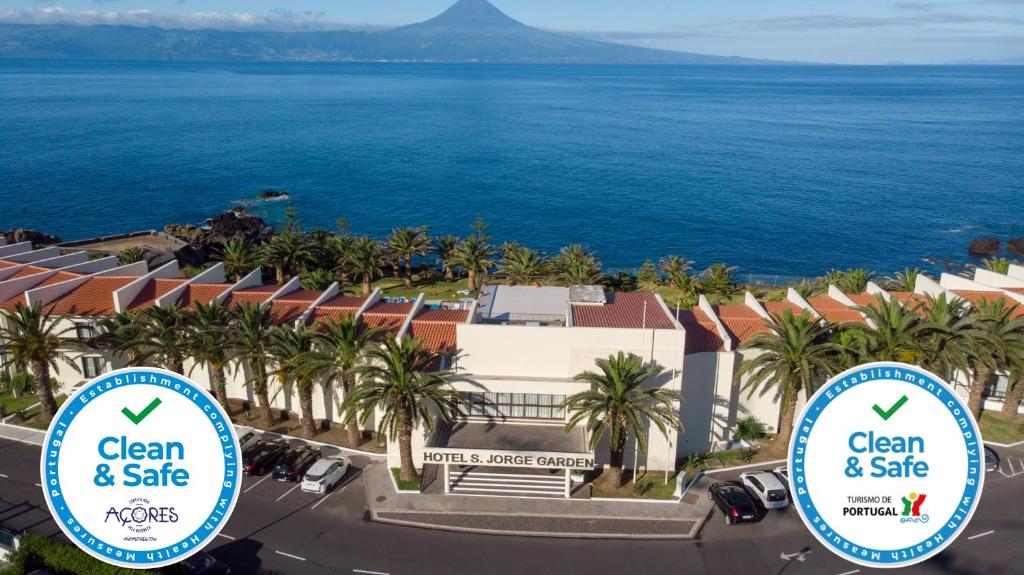 a view of the ocean from the top of a building at Hotel Sao Jorge Garden in Velas