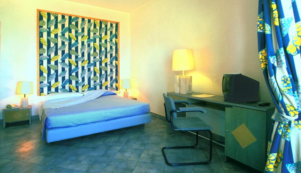 Postel nebo postele na pokoji v ubytování Grand Hotel Palace