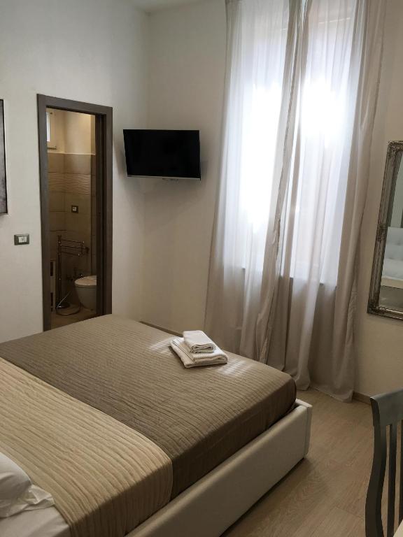 Postel nebo postele na pokoji v ubytování Maestrale Charme Rooms