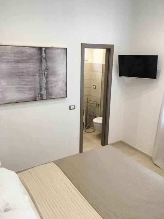 Postel nebo postele na pokoji v ubytování Maestrale Charme Rooms