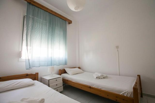 Postel nebo postele na pokoji v ubytování Antonia Rooms