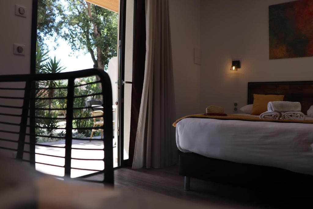 Postel nebo postele na pokoji v ubytování Hôtel Padolo