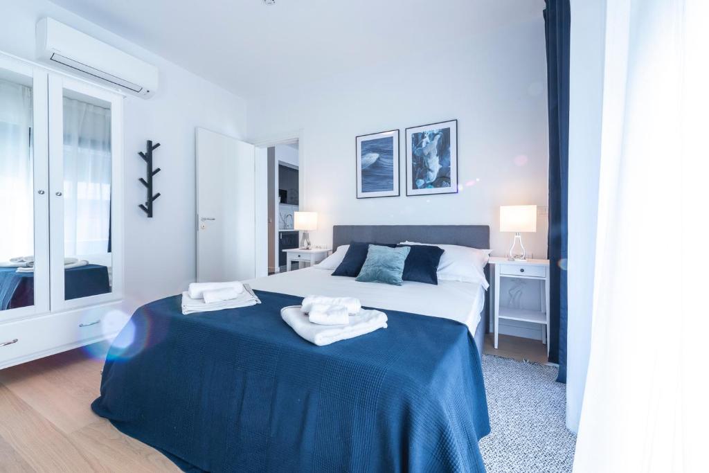 Postel nebo postele na pokoji v ubytování Apartments Adriatic Oasis & Marine View