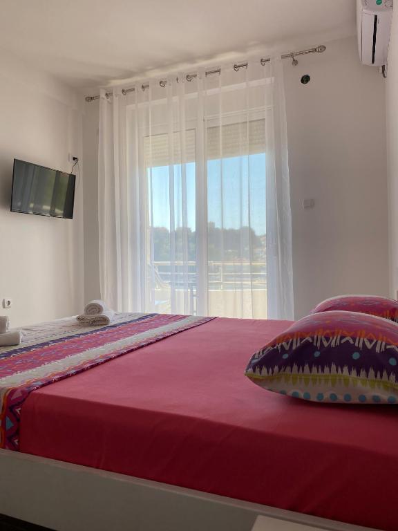 Postel nebo postele na pokoji v ubytování Seafront Apartments