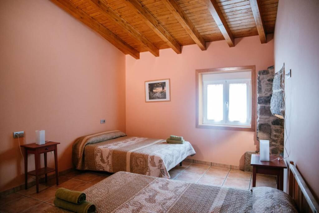 A bed or beds in a room at Casa de Vacaciones en Galicia de Karlos