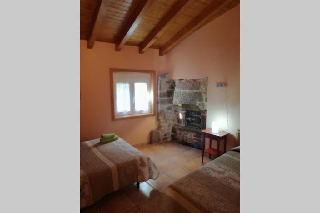 A bed or beds in a room at Casa de Vacaciones en Galicia de Karlos