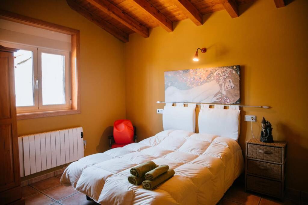 A bed or beds in a room at Casa de Vacaciones en Galicia de Karlos