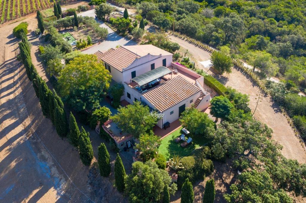 an overhead view of a large white house at Casale Le Pitte in Porto Azzurro