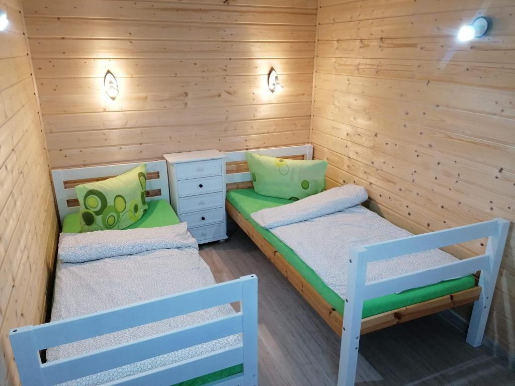 Postel nebo postele na pokoji v ubytování Domek u Beaty