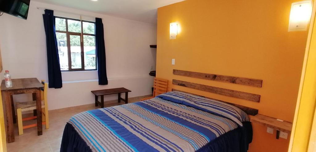 Postel nebo postele na pokoji v ubytování CASA LUPITA