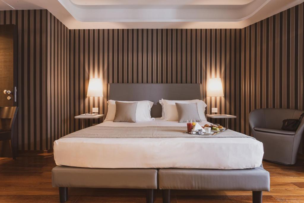 Postel nebo postele na pokoji v ubytování Callistos Hotel & Spa
