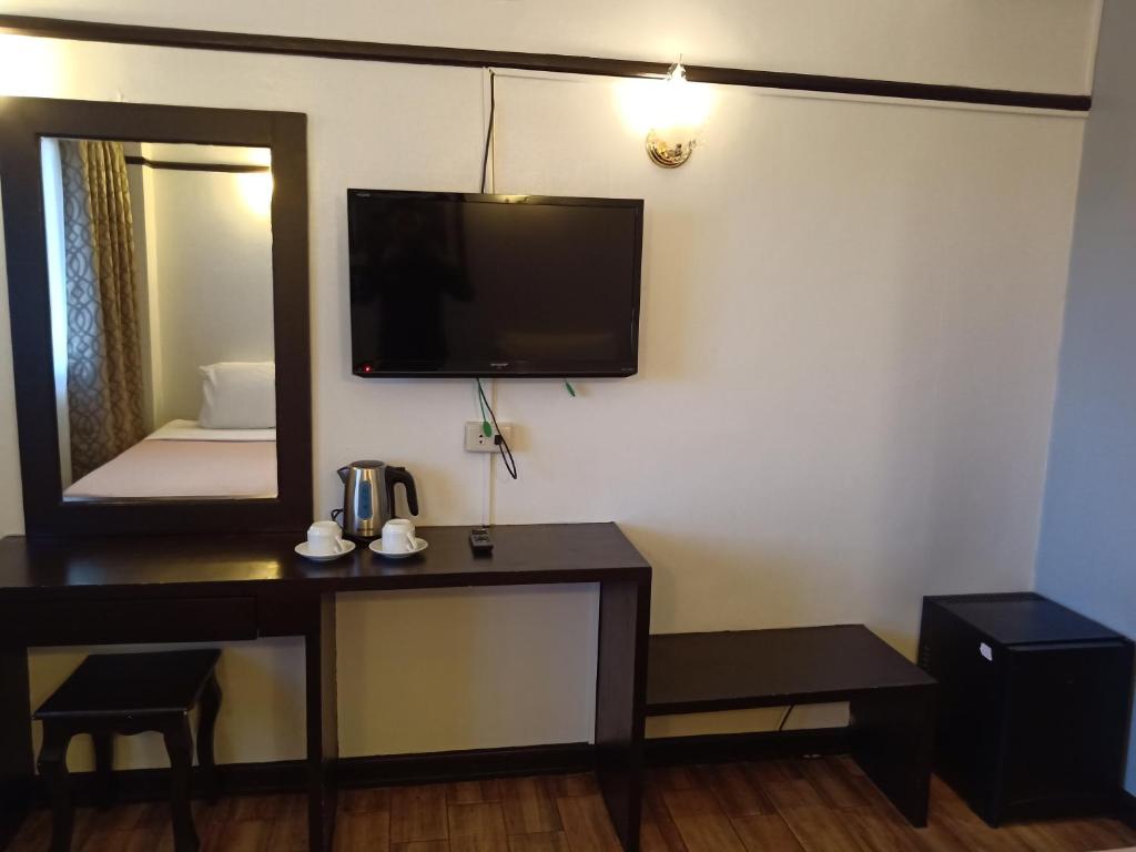 TV a/nebo společenská místnost v ubytování Venus Parkview Hotel