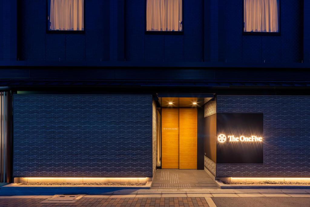 a front door of a store at night at The OneFive Kyoto Shijo in Kyoto