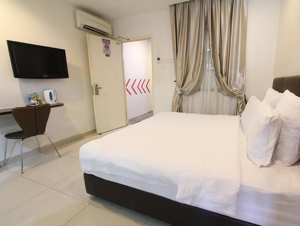 Postel nebo postele na pokoji v ubytování Hotel JSL
