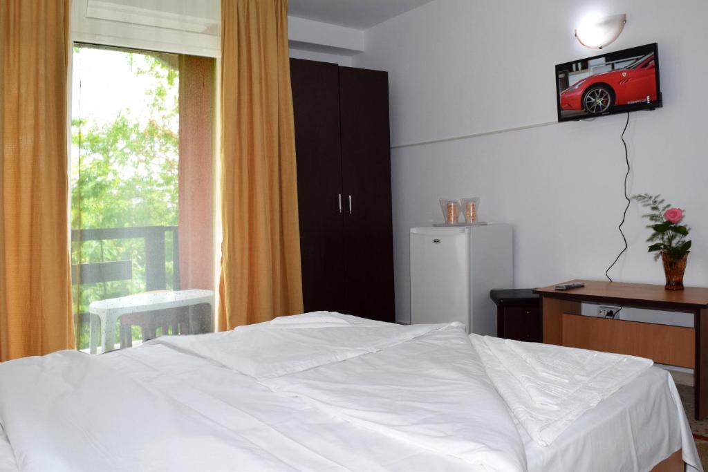 Postel nebo postele na pokoji v ubytování Hotel Sanda