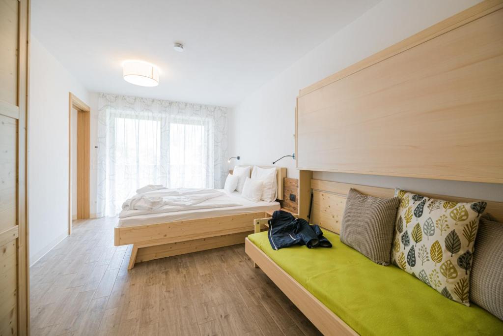 Postel nebo postele na pokoji v ubytování Residence Plan De Corones