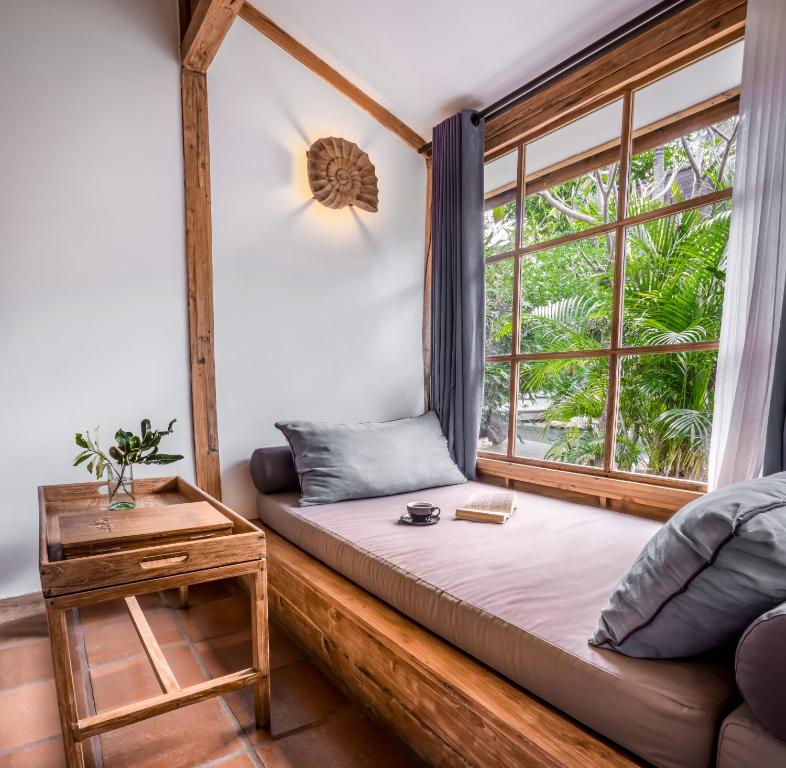 Postel nebo postele na pokoji v ubytování Kuno Villas