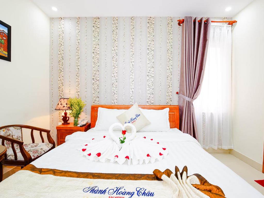 Postel nebo postele na pokoji v ubytování Thành Hoàng Châu Boutique Hotel