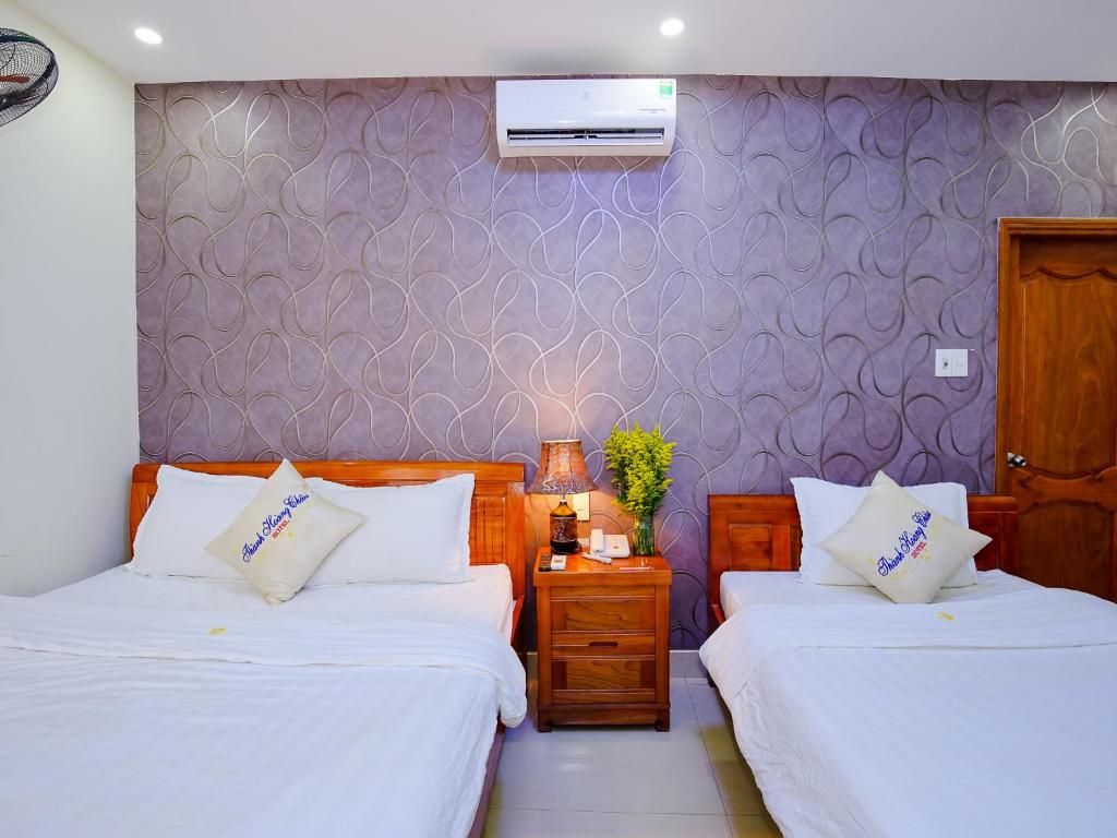 Postel nebo postele na pokoji v ubytování Thành Hoàng Châu Boutique Hotel