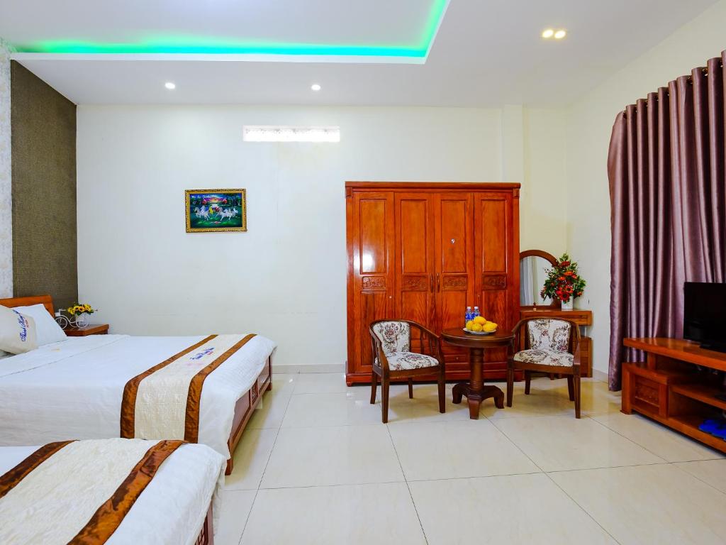 Postel nebo postele na pokoji v ubytování Thành Hoàng Châu Boutique Hotel