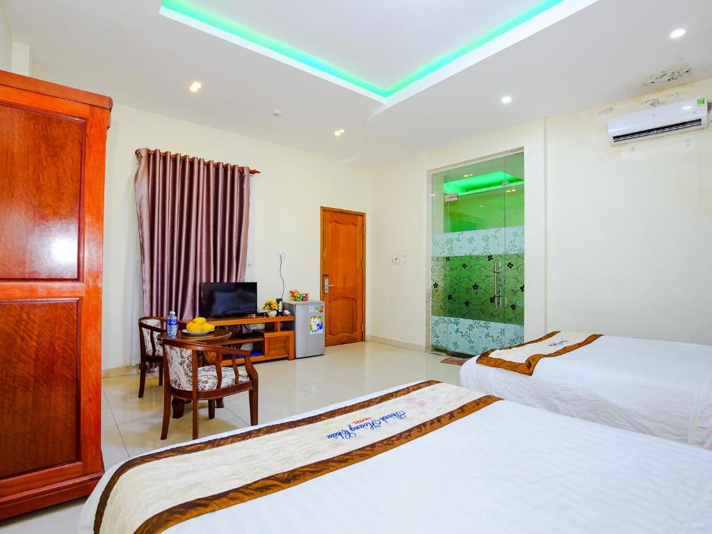 Postel nebo postele na pokoji v ubytování Thành Hoàng Châu Boutique Hotel