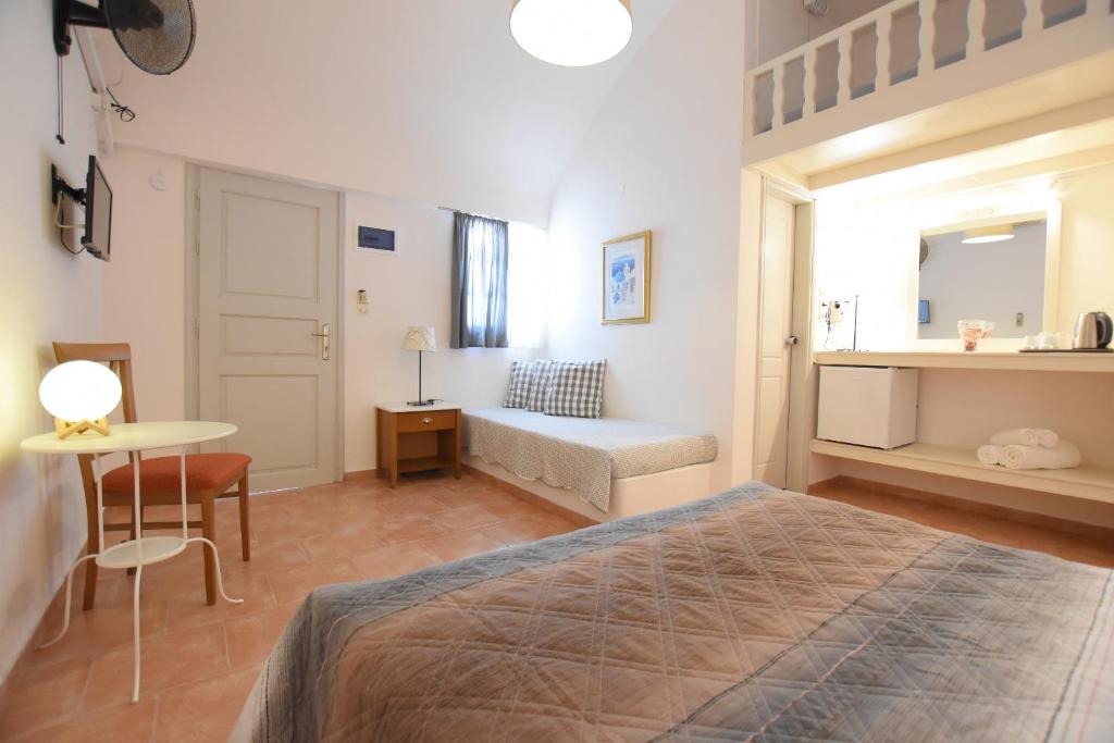 Postel nebo postele na pokoji v ubytování Rodakas Hotel