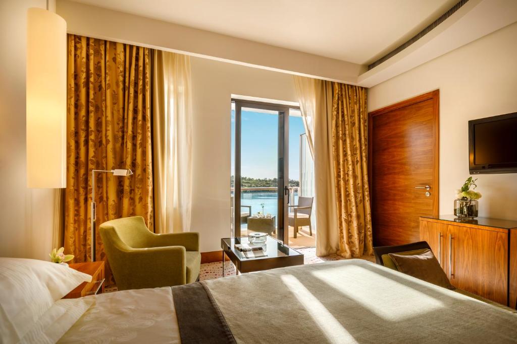 Кровать или кровати в номере Monte Mulini Adults Exclusive Hotel by Maistra Collection