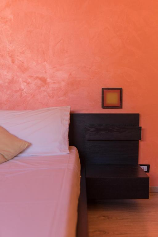 Postel nebo postele na pokoji v ubytování La Fontanella Apartment