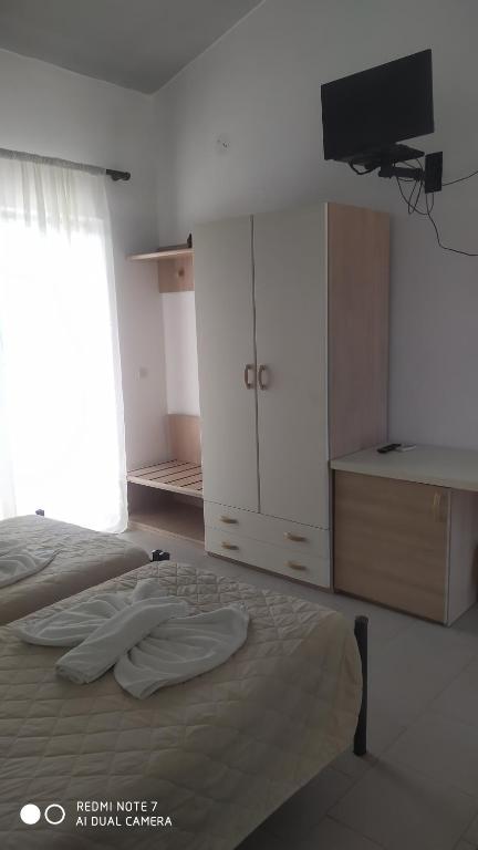 Postel nebo postele na pokoji v ubytování Monika Hotel Sidari