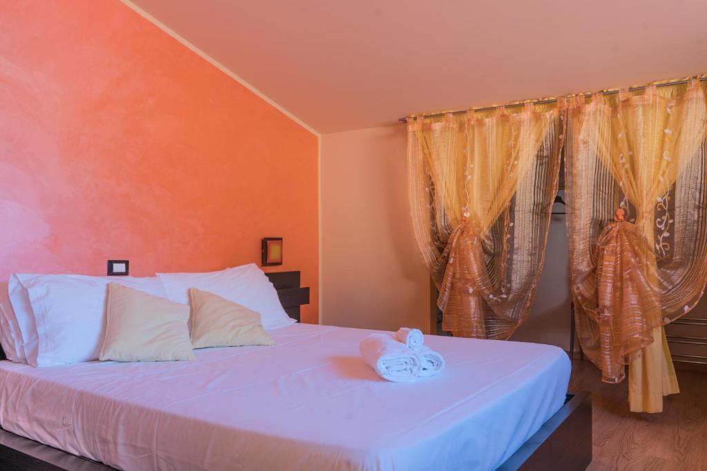Postel nebo postele na pokoji v ubytování La Fontanella Apartment