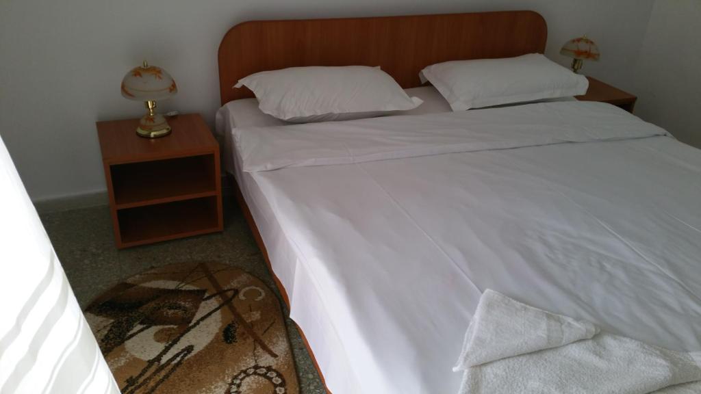 Postel nebo postele na pokoji v ubytování Hotel Sanda