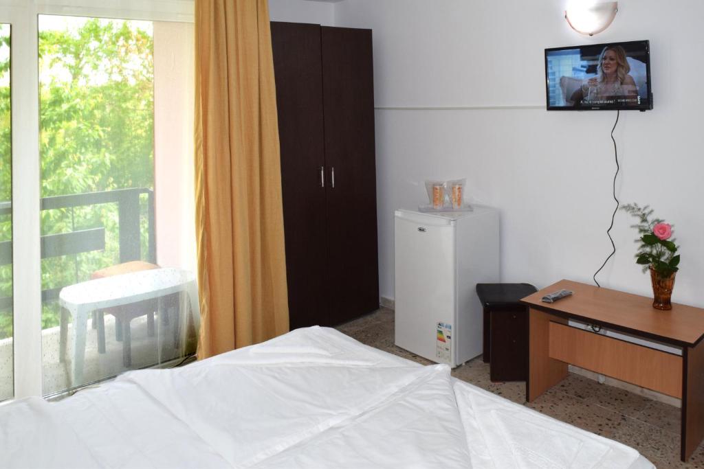 Postel nebo postele na pokoji v ubytování Hotel Sanda