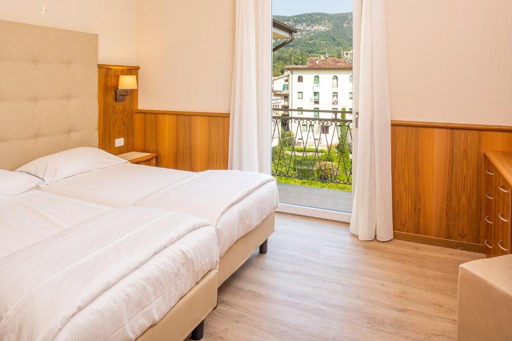 Postel nebo postele na pokoji v ubytování Hotel Centrale