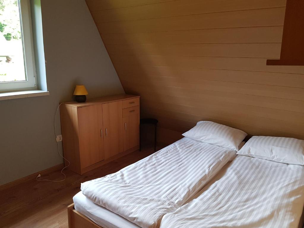 Postel nebo postele na pokoji v ubytování CIME Ekonomik