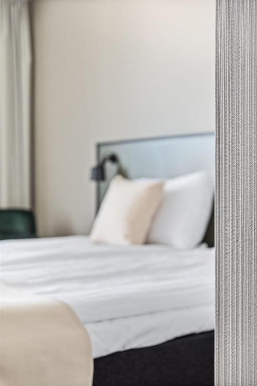 Postel nebo postele na pokoji v ubytování Comfort Hotel Sundsvall