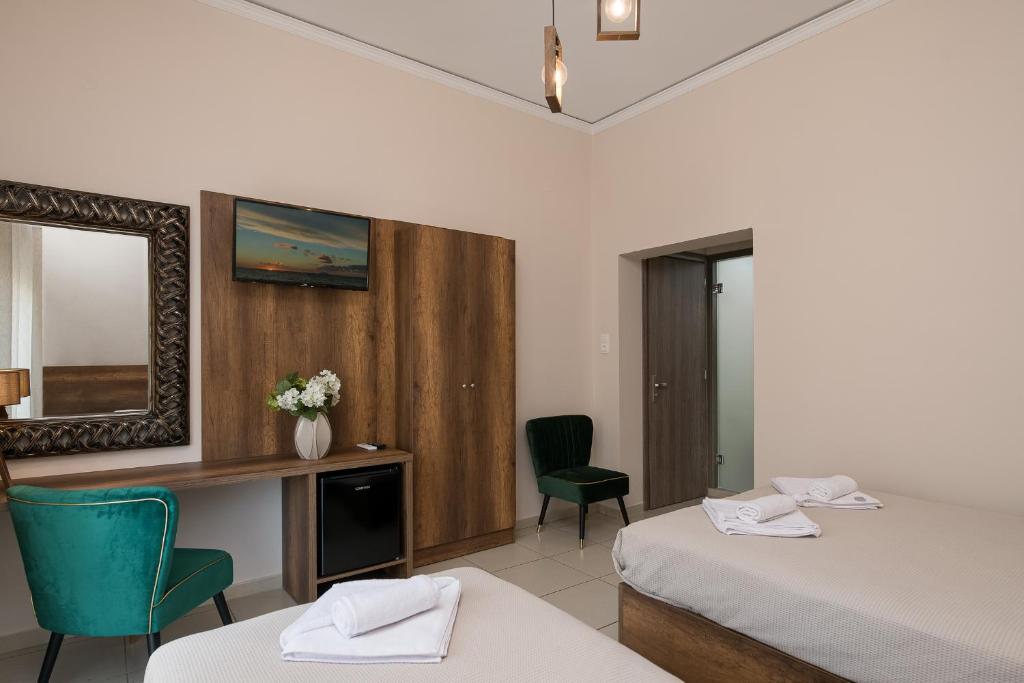 Postel nebo postele na pokoji v ubytování Olympic Hotel
