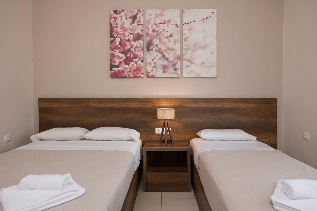 Postel nebo postele na pokoji v ubytování Olympic Hotel