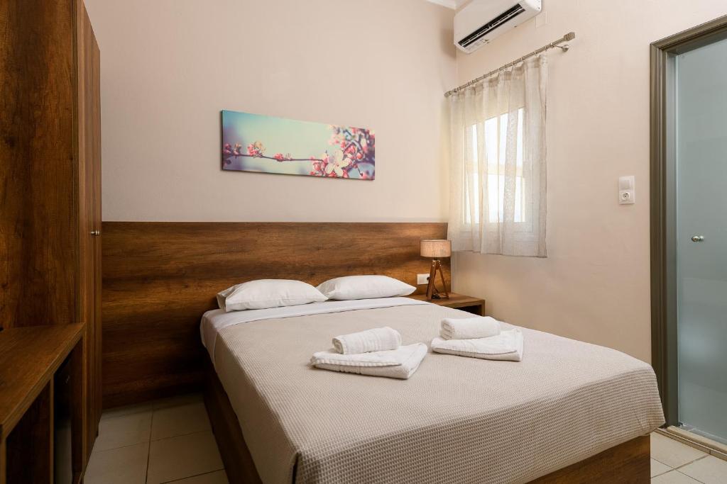 Postel nebo postele na pokoji v ubytování Olympic Hotel