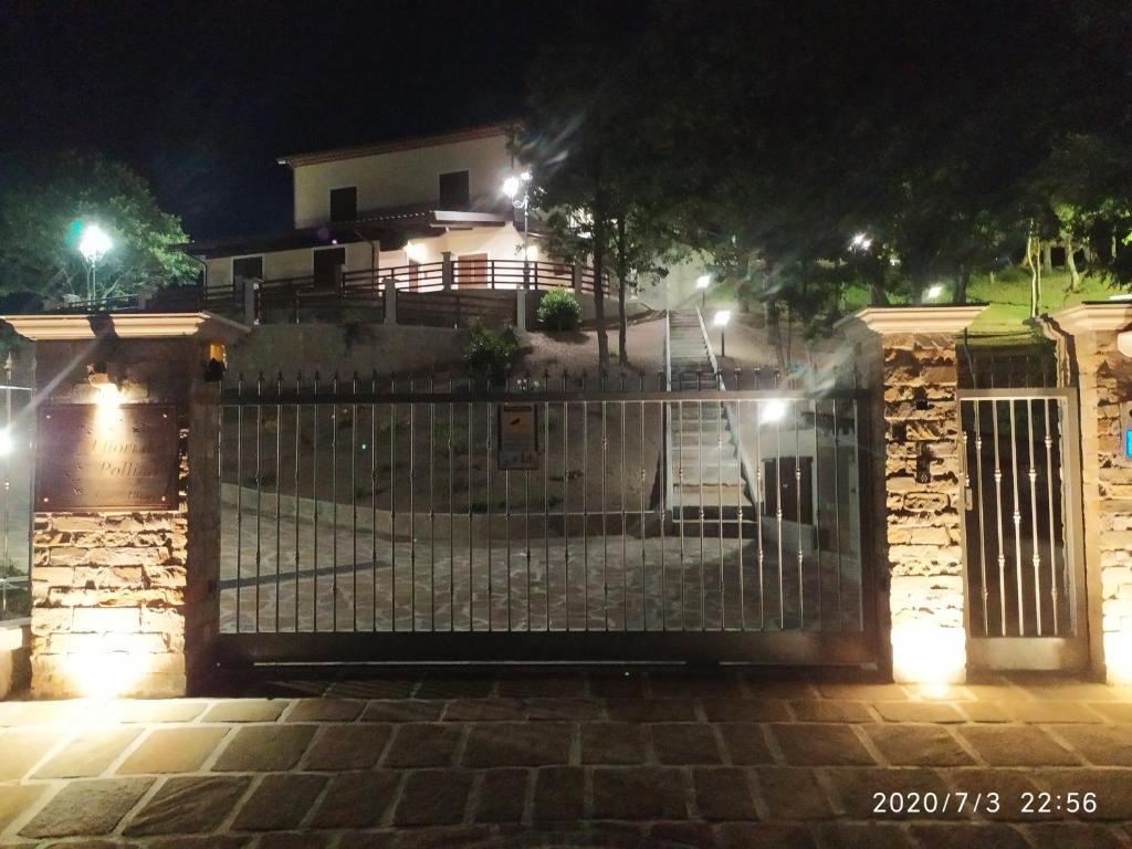 una puerta delante de una casa por la noche en I fiori del Pollino - Guest House, en San Severino Lucano