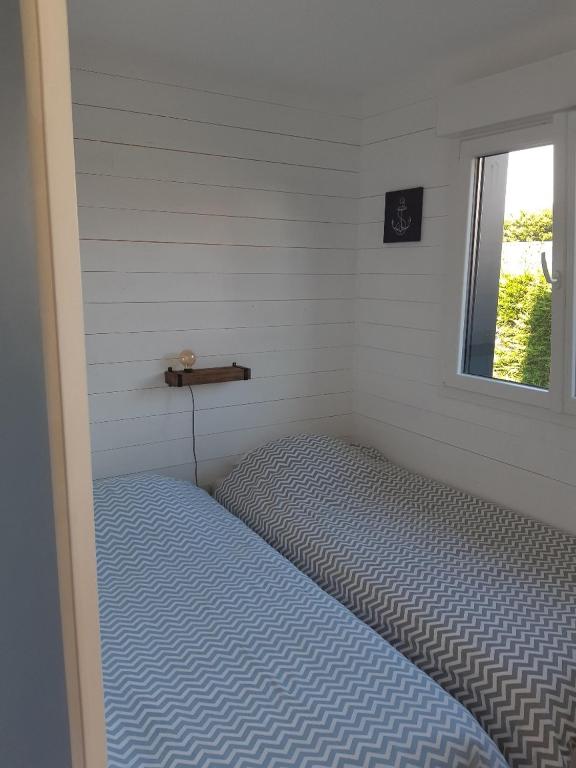 Postel nebo postele na pokoji v ubytování ETABLISSEMENT CHEZ JULES