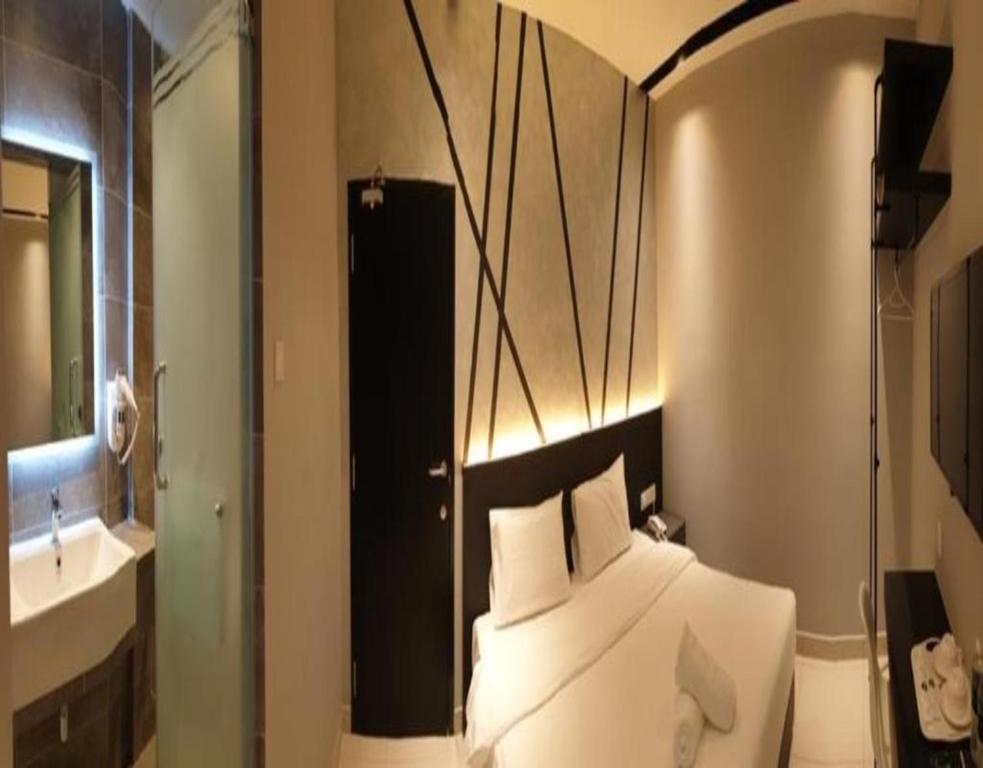 Katil atau katil-katil dalam bilik di Suite Dreamz Hotel Banting