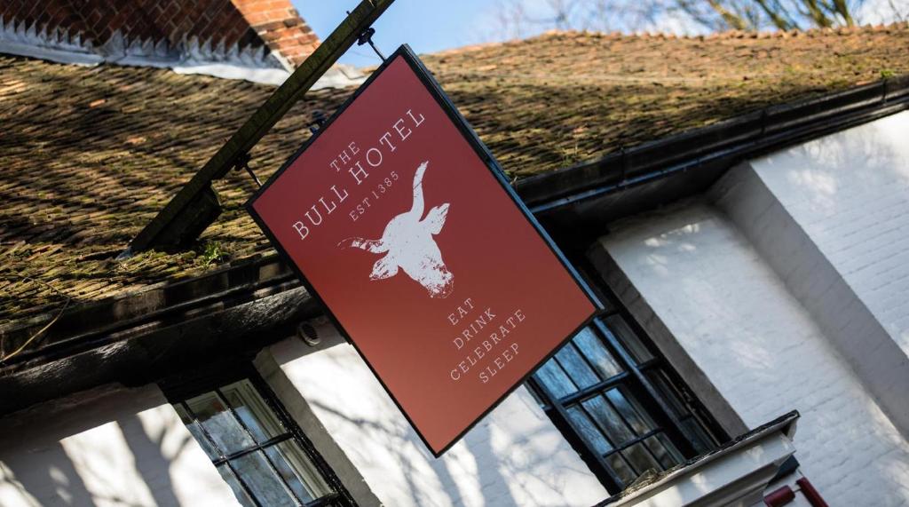 a sign for a rabbit restaurant in front of a building at The Bull Hotel Maidstone/Sevenoaks in Wrotham