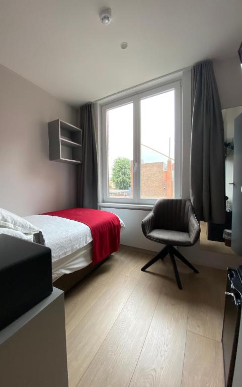 Postel nebo postele na pokoji v ubytování Hotel New Regina